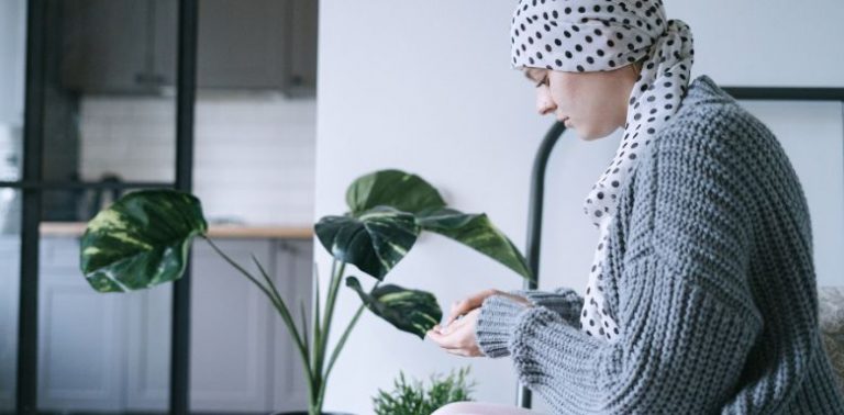 A female cancer patient taking medication.
