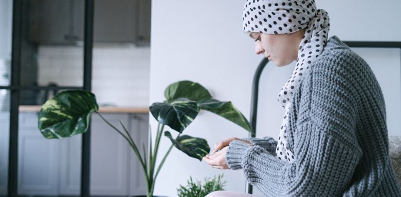 A female cancer patient taking medication.